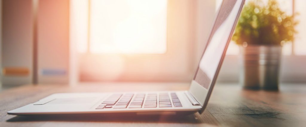 Office workplace with laptop working on landing pages