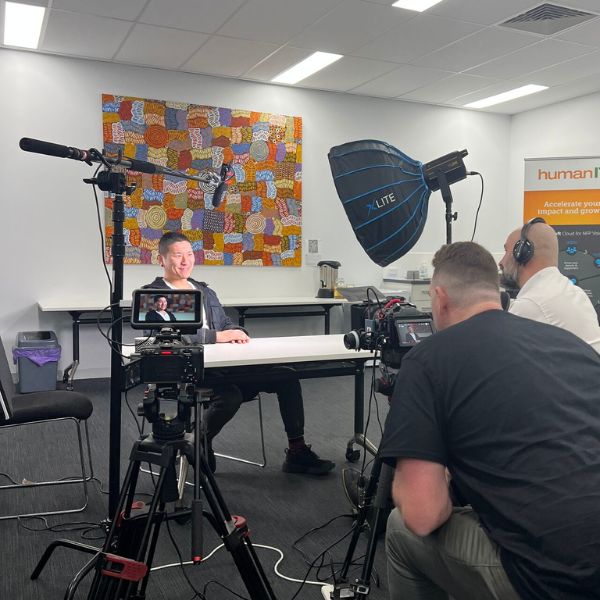 Behind the scenes photo of Vincent from WEstjustice being interviewed on camera.