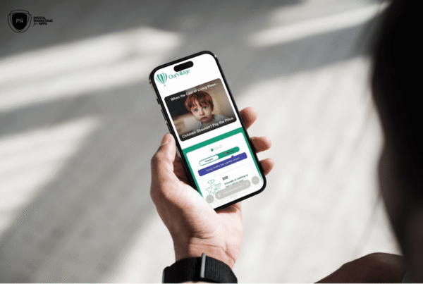 Person holding phone with campaign page visible on the screen.